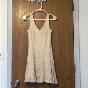 Cream colored A-line, sleeveless dress